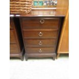 A stag minstrel bedside chest of four drawers