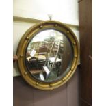 A reproduction regency style convex mirror