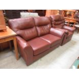 A modern brown leather two seater settee with a similar matching chair