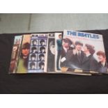 A collection of eleven Beatles LPs