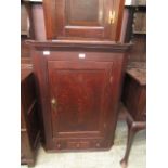 An 18th century oak wall hanging corner cupboard,