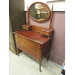 An Edwardian mahogany and inlaid dressing chest