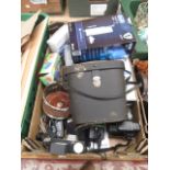 A tray containing binoculars, cameras, wine coaster etc.