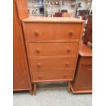 A mid 20th century chest of four long drawers