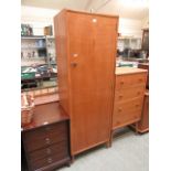 A mid 20th century hall cupboard with single door