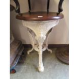 A 19th century cast iron white painted pub table with mahogany top