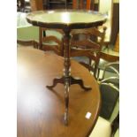 A reproduction mahogany wine table