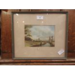 A framed and glazed watercolour of ladies camping by river