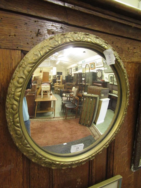 A gilt framed convex mirror