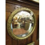 A gilt framed convex mirror