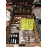 A tray containing cased flatware,