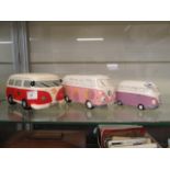 Three ceramic money boxes in the form of Volkswagen campers