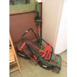 A Qualcast electric lawnmower together with a strimmer minus cable
