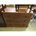 An early 20th century oak chest of three long drawers