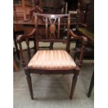 An early 20th century open arm chair