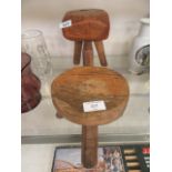 Two small hand crafted wooden stools