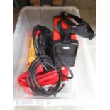 A box containing an electric arc welder, gloves etc.