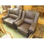 A brown leather effect two seater sofa with a matching chair