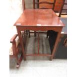 A mahogany side table with stretcher under