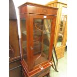 A glazed reproduction cabinet