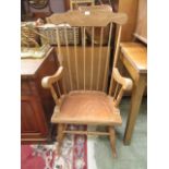 A spindle back rocking chair