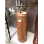 A brass and copper fire extinguisher