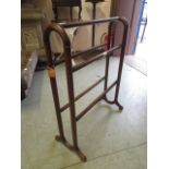 An early 20th century mahogany towel rail