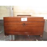 A 19th century mahogany tea caddy with glass bowl