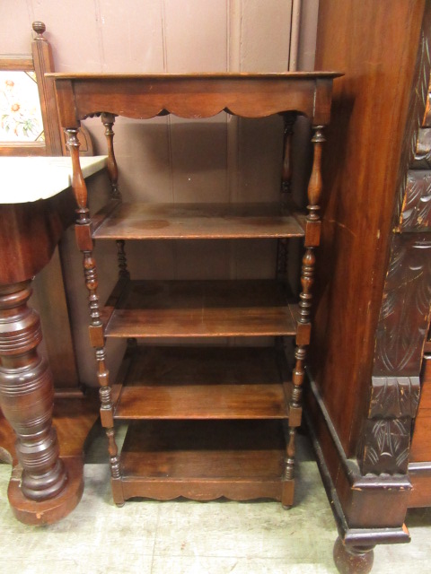 An early 20th century mahogany five tier hallway stand