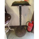 A 19th century cast iron tall pub table base