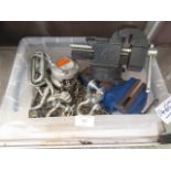 A box containing two bench vices, block and tackle set etc.