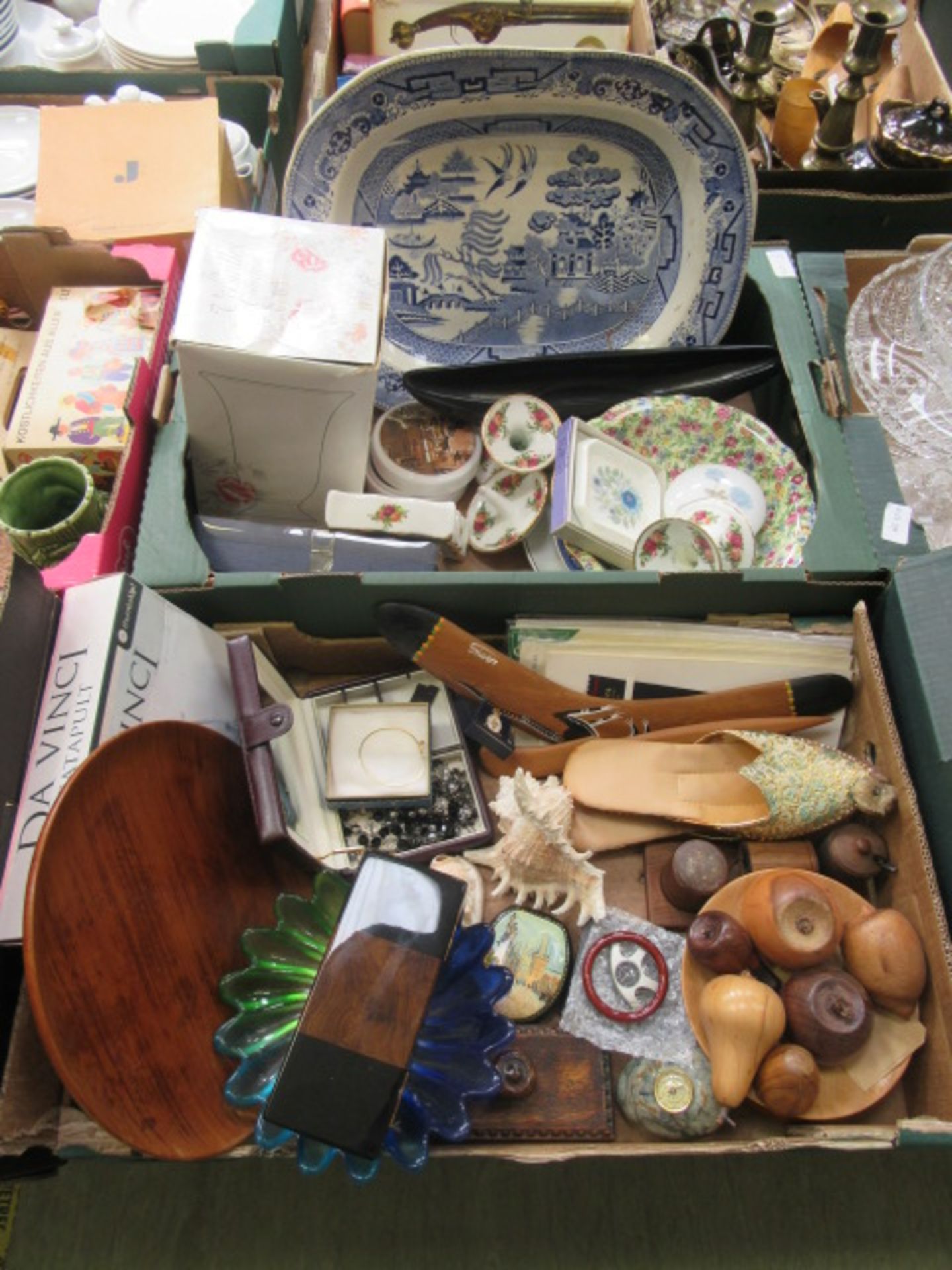 Two trays containing wooden fruit, blue and white meat plate, boomerang, ladies slippers,