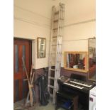 A triple extended aluminium ladder