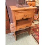 A modern pine single drawer bedside cabinet together with a hand crafted plank style refractory