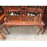 A reproduction walnut rectangular occasional table
