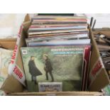 A carton of LPs to include Bucks Fizz, Simon and Garfunkel,