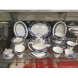 A part Wedgwood dinner set 'Blue Siam' comprising of plates, cups, saucers, tea pot etc.