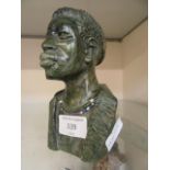 A green marble carved bust of African man