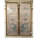 A pair of framed and glazed oriental silk embroideries