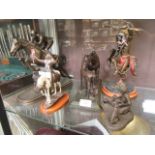 A selection of resin cast figures, one of horse and jockey, horse and foal,