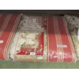 A red and cream quilted bed throw measuring 250 cm by 265cm