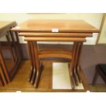 A nest of three mid 20th century teak occasional tables