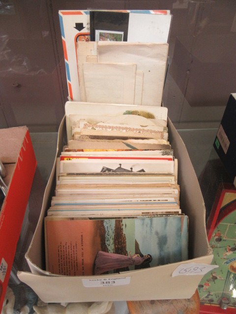 A box of assorted post cards