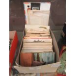 A box of assorted post cards