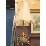 A gilt metal columned classical style table lamp on marble base