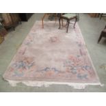 a Chinese rectangular floral decorated rug