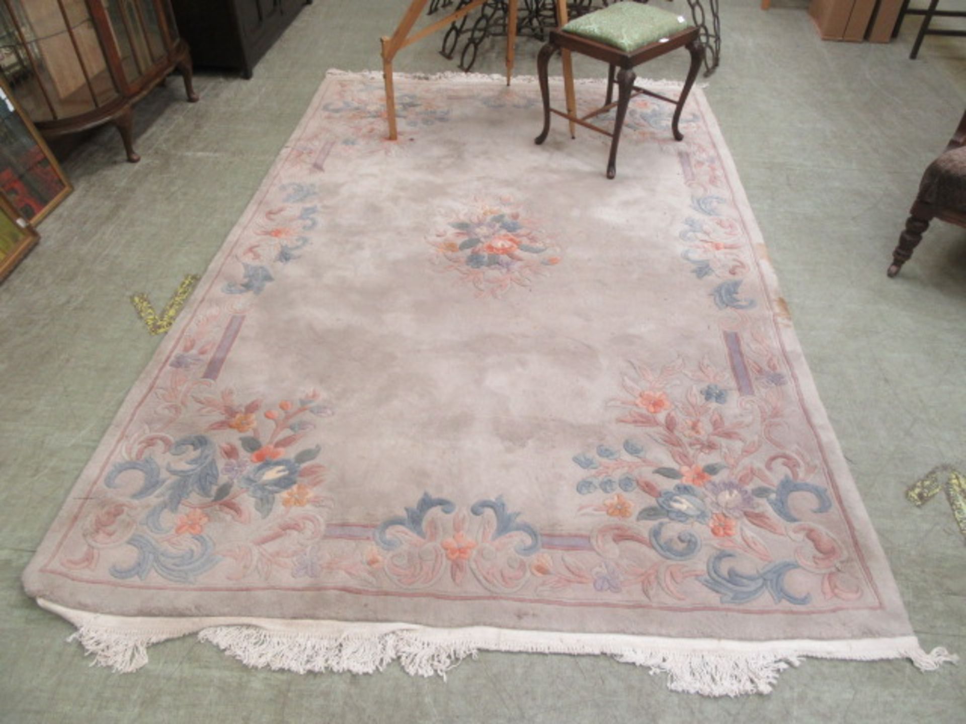 a Chinese rectangular floral decorated rug