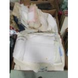 Two boxes of assorted fabrics to include linen and laceware