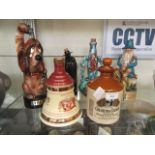 A collection of six decanters by Wade some musical