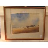 A framed and glazed watercolour of beach scene